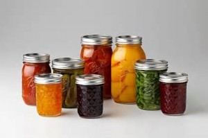 canning jars filled with fruit.