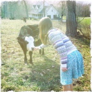 Girl with calf