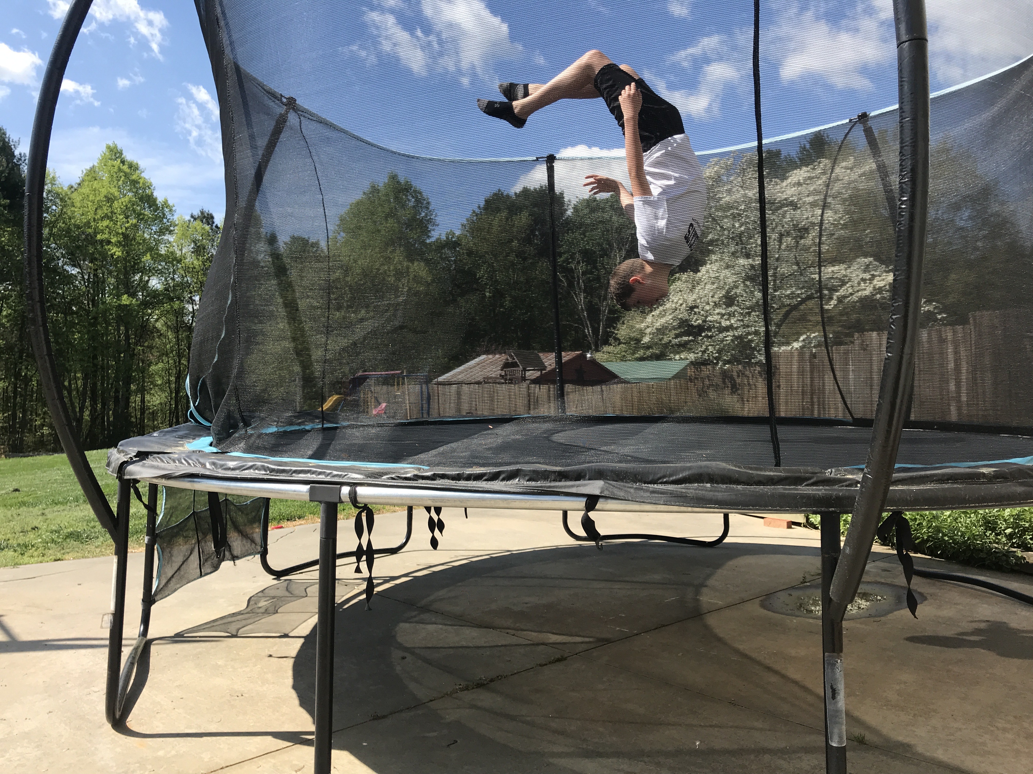 boy jumping on trampoline