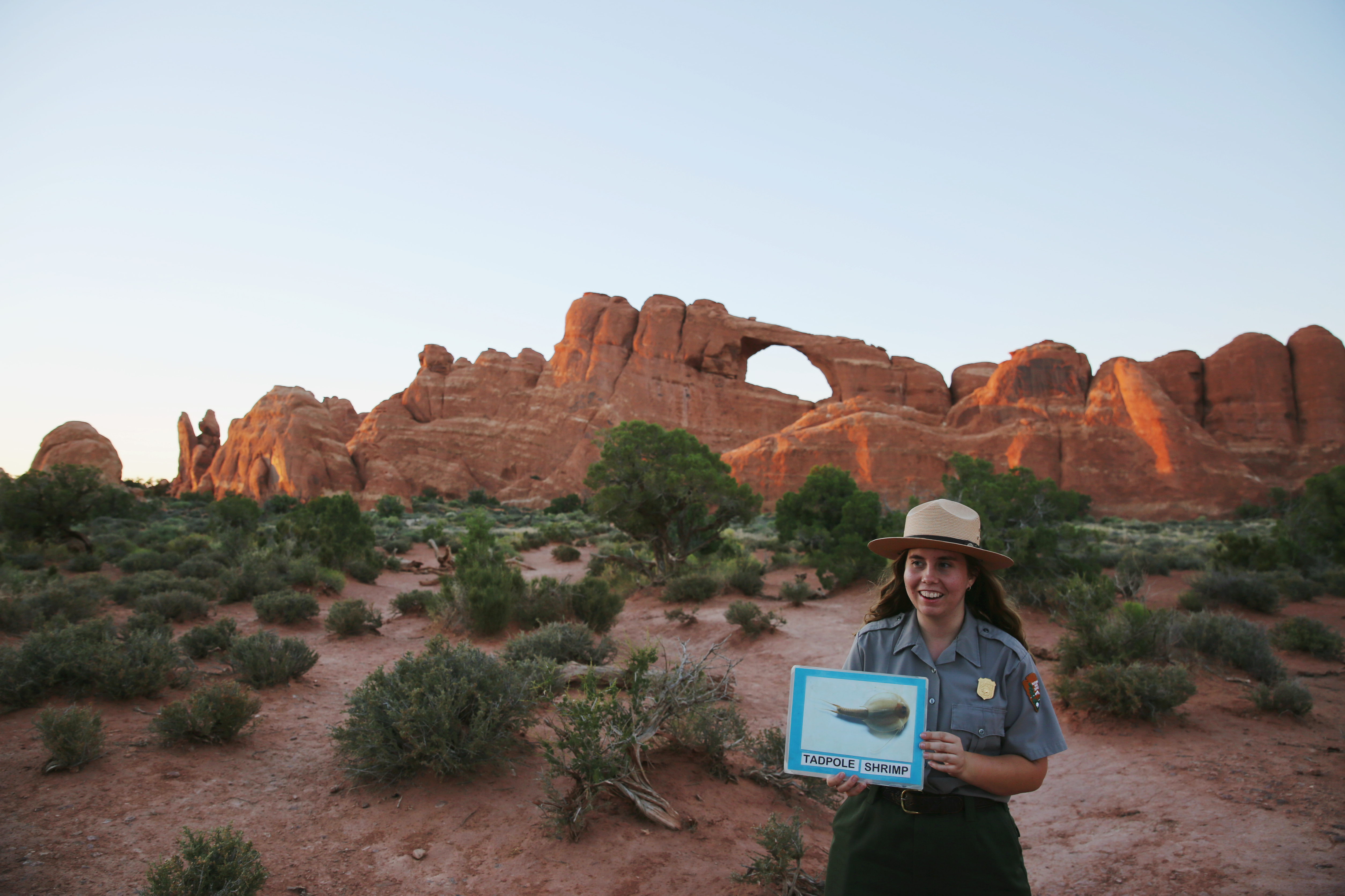 Courtesy photo from Kristin Vinduska): Kristin Vinduska speaks to visitors at Arches National Park during an internship. She is now employed as a park ranger with the National Park Service.