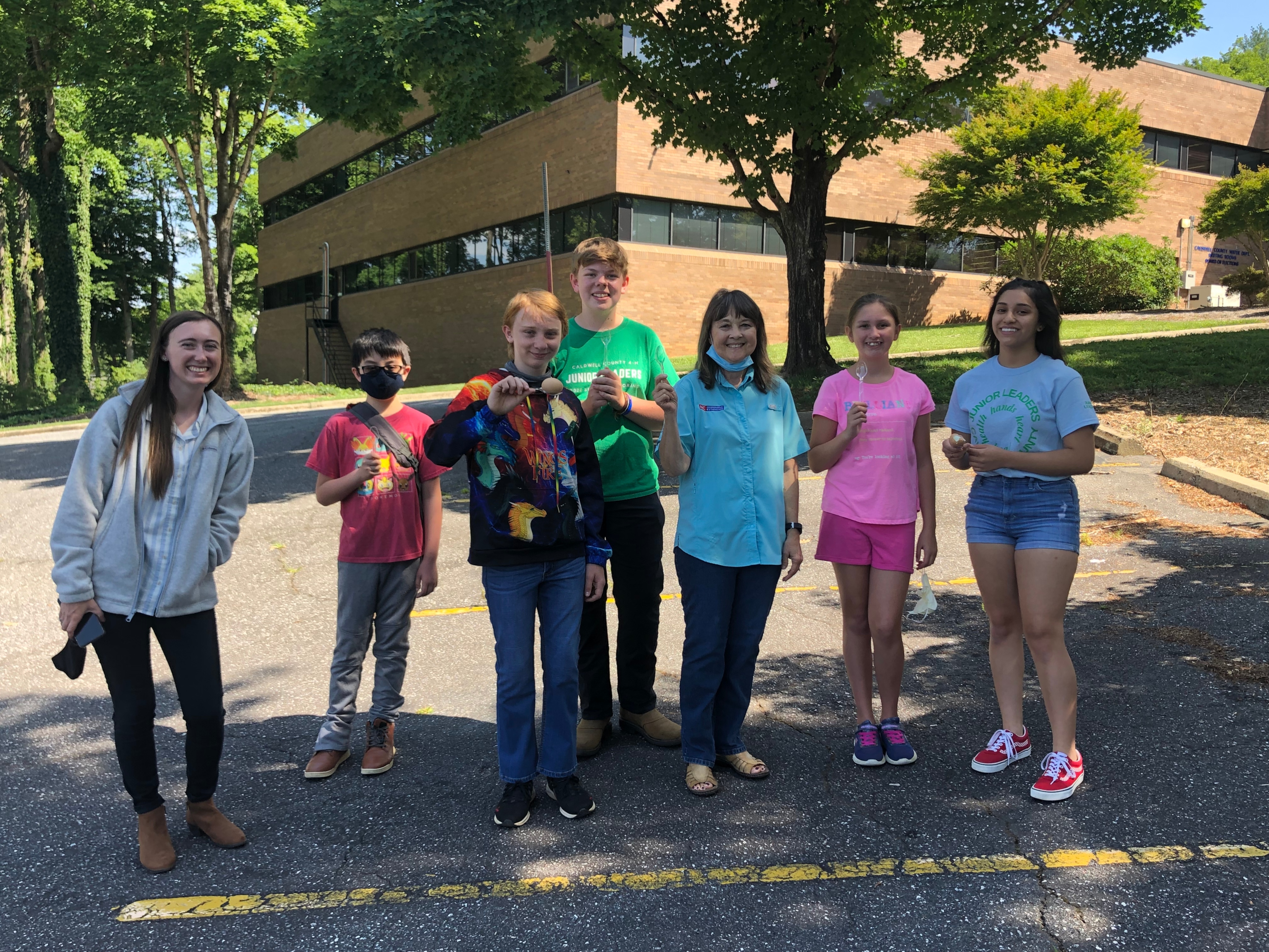 Participants at Caldwell County 4-H’s “Egg-Cellent Poultry” camp pose after an egg and spoon race. In addition to learning about poultry and food science, games were a highlight for youth and teen leaders who attended the program in July 2021.