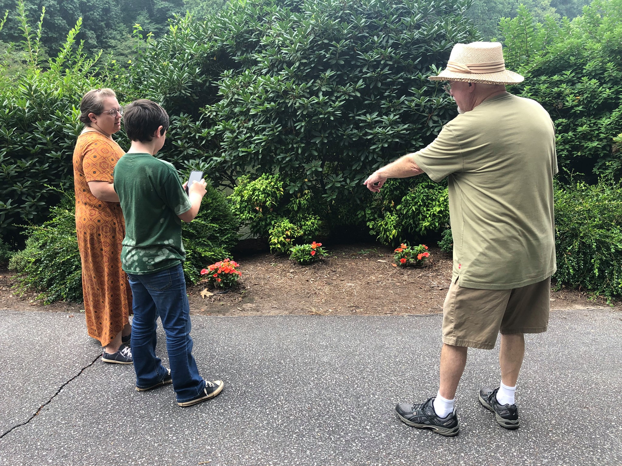 Steve West (left) speaks with Caleb and Tiffany Schwartz during a recent 4-H photography workshop at Broyhill Walking Park.
