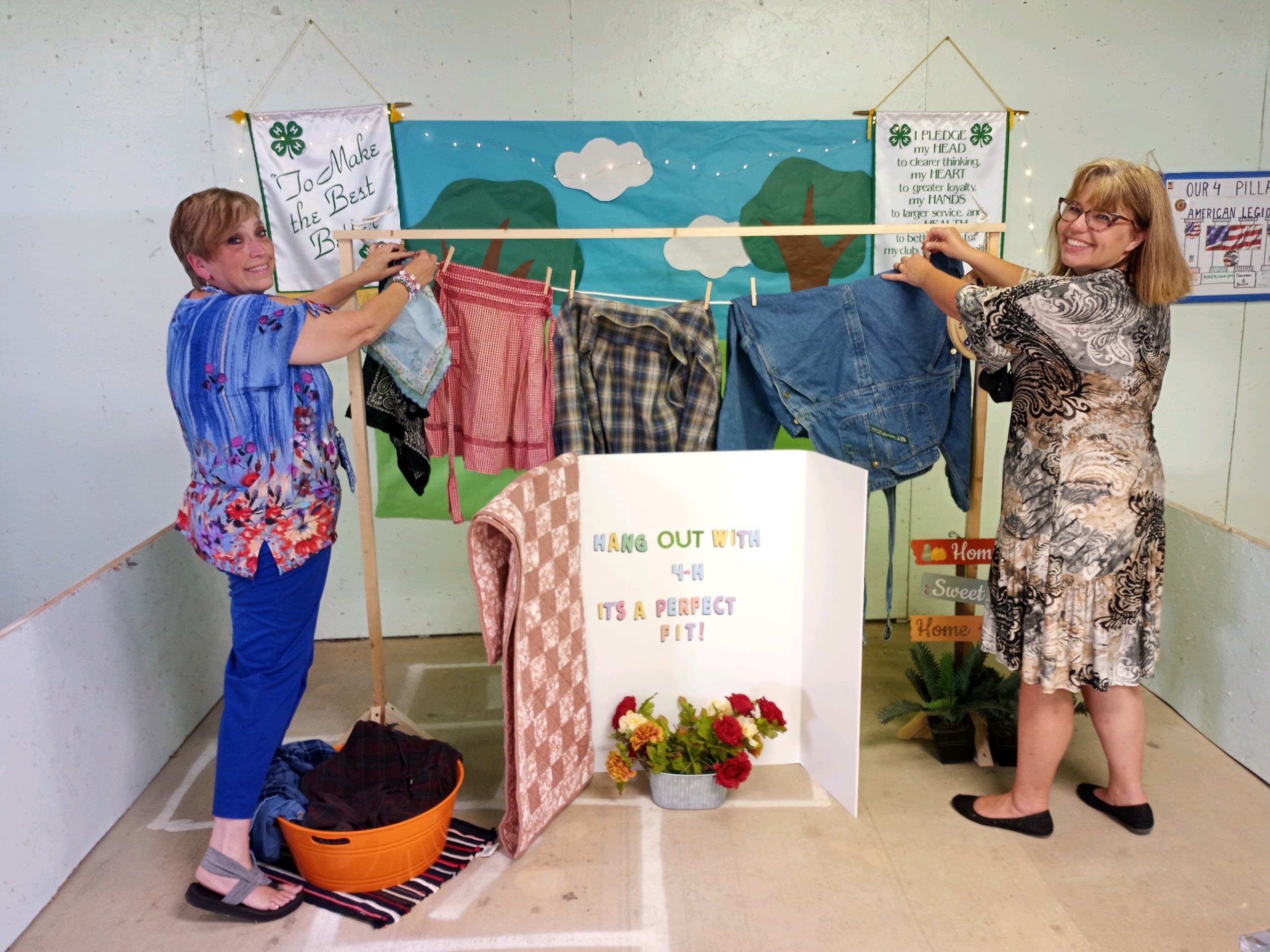 Baton Bear Paws 4-H Club leaders put the finishing touches on their 2021 fair booth display.