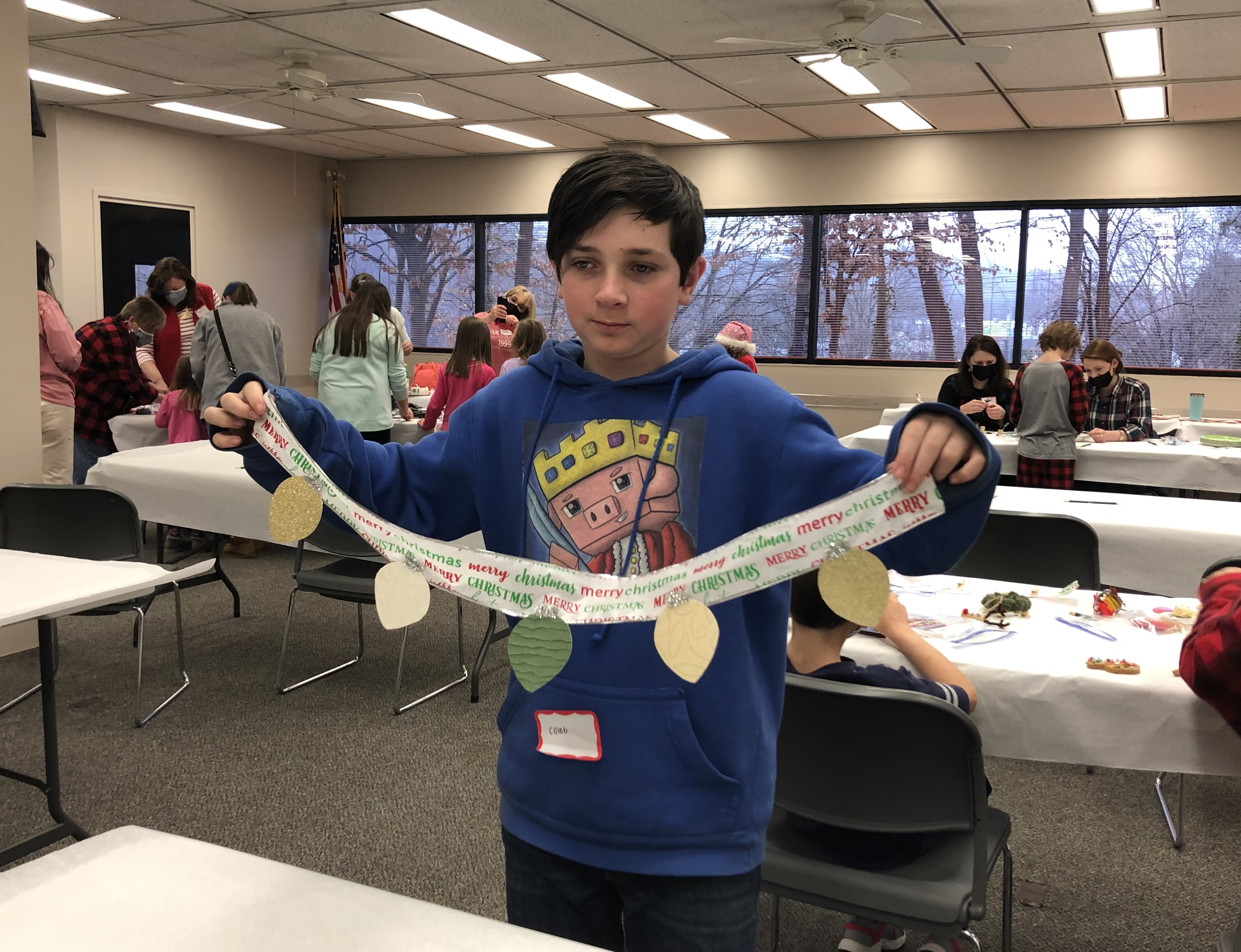 Caleb Schwartz poses with his craft, a card holder at a recent 4-H social. Writing letters to family or friends can help people connect with others, reflect on what they are grateful for and spread holiday cheer. 