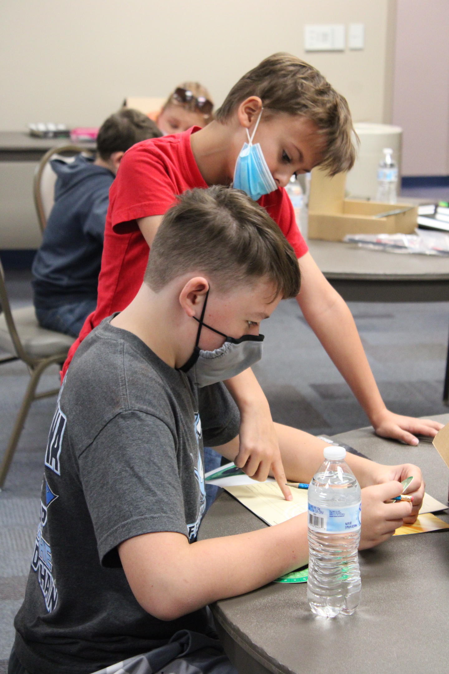 Wilson Deal and Drew Penny work together on a cipher activity during the 2021 4-H STEM Challenge: Galactic Quest event last fall.