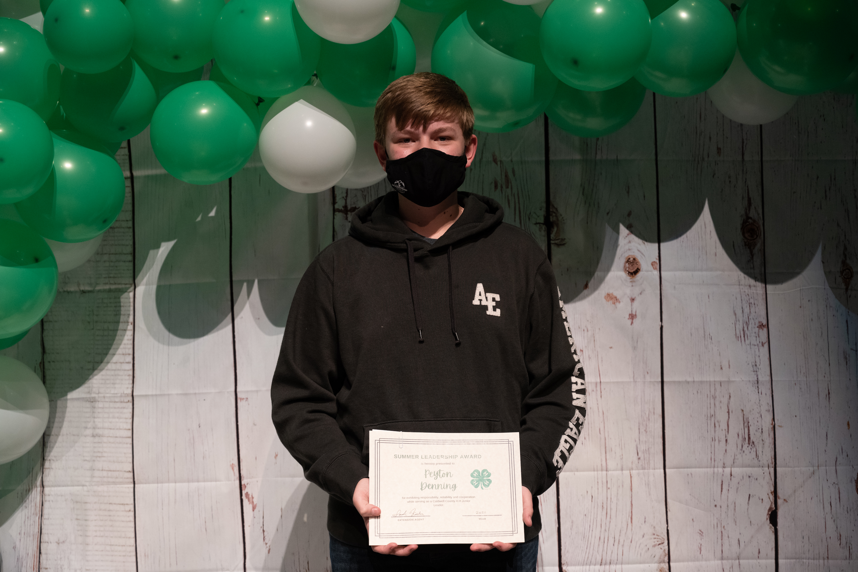 Peyton Denning poses with his certificate at the 4-H Achievement Night.