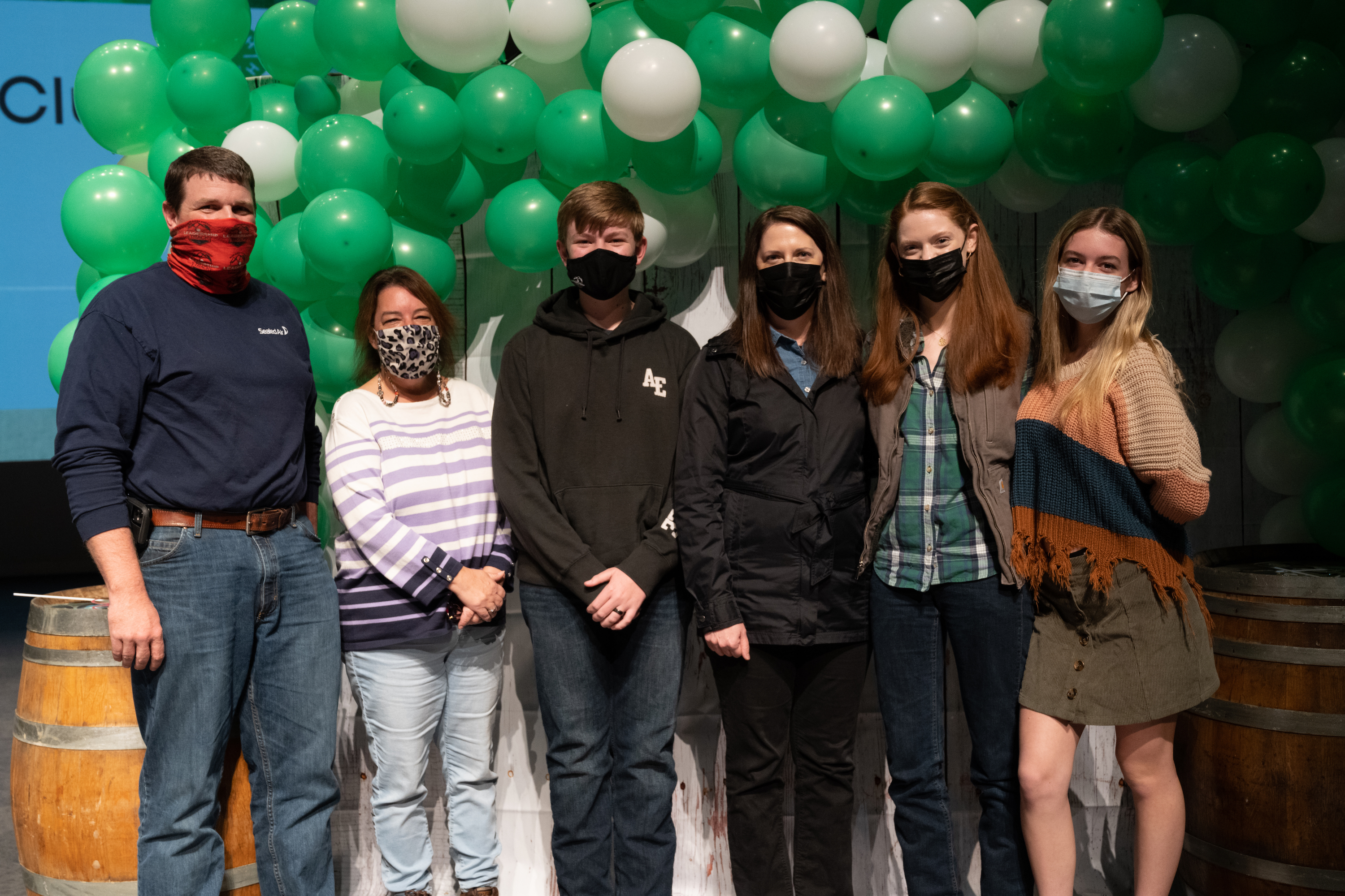 Members and leaders of the 4-H Saddle Club pose together at 4-H Achievement Night.