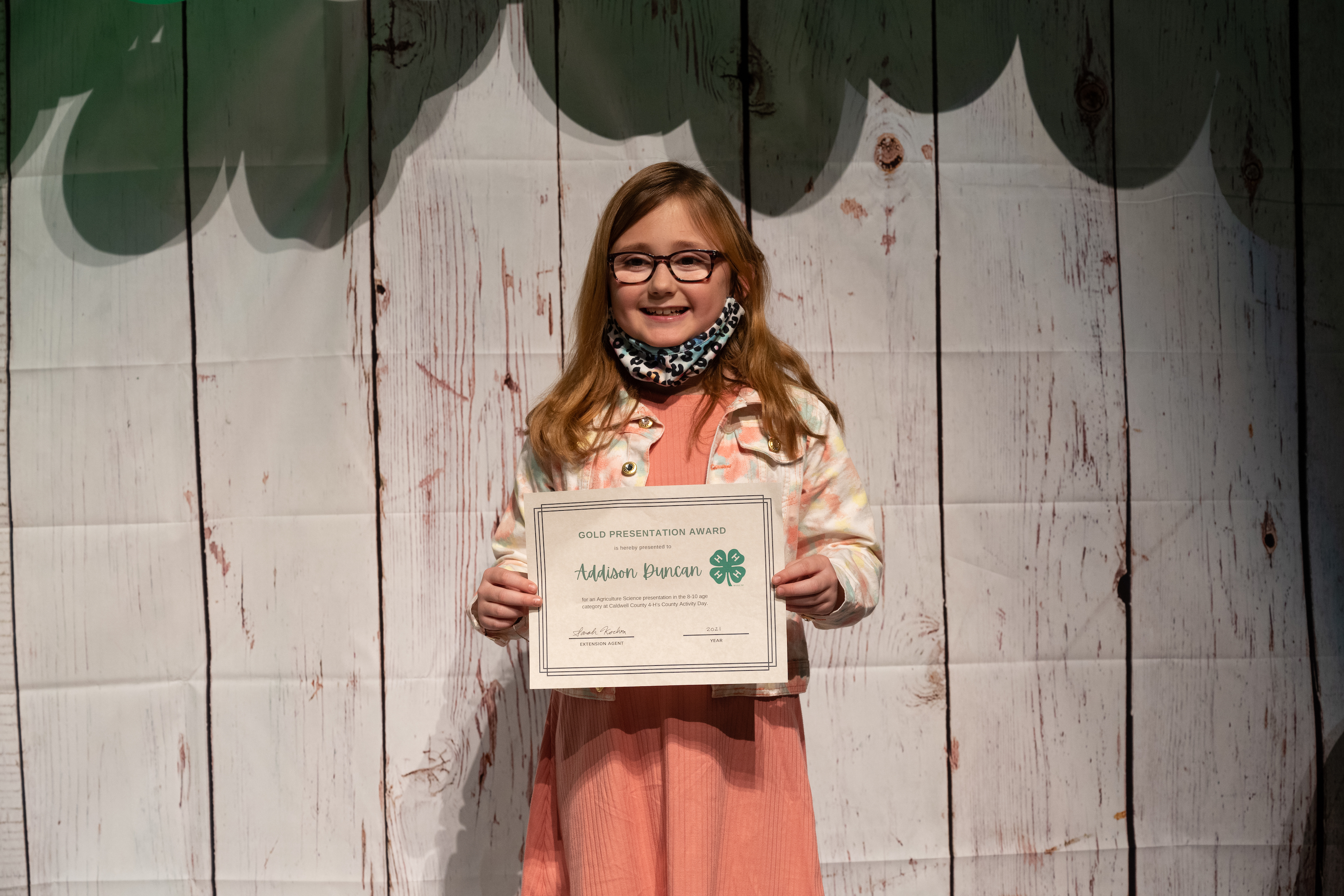 Addison Duncan poses with her certificate at the 4-H Achievement Night.