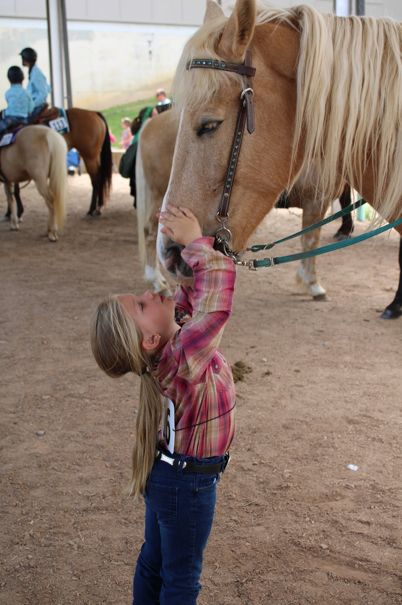 Brooklyn Arney bonds with horse Fabio at the West District 4-H Horse Show on April 30, 2022. The pair participated in Cloverbud classes at the show.