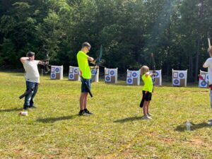 Three Caldwell County archers, Elijah Dillon, Jaxson Price and Cora Baker shoot at the West Regional 4-H Shooting Sports Tournament on August 13 in Polk County, NC.