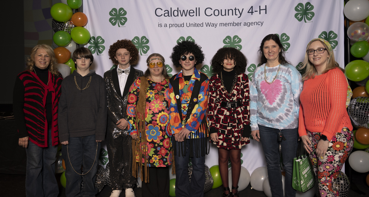 Cooking 4-H Club members and leaders pose at Caldwell County 4-H Achievement Night on February 3, 2023. Pictured from left to right is Debra Woods, Keaton Benfield, Malachi Schwartz, Tiffany Schwartz, Caleb Schwartz, Zoe Woods, Lori Joplin, and Macy Sparks.