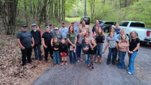 Members of the Livestock 4-H Club pose with other community members after a farm tour during their April 2023 meeting.