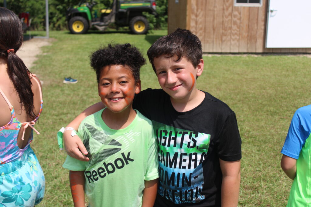 4-H members Jay and Leo, ages 8 and 9, pose between outdoor activities. Although activities at the Cloverbuds 4-H Club are planned with youth ages 5-7 in mind, 8 and 9 year-olds can also join and participate in the club.