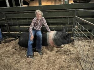 Caldwell County 4-H Livestock Club member Payton Taylor poses with the pig called Princess Petunia!