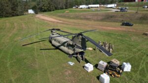 chinhook helicopter being loaded with supplies for farm animals